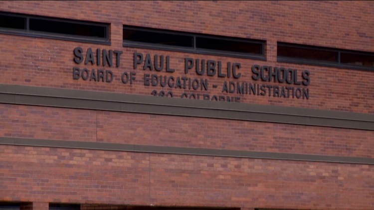 A St. Paul Public School Board meeting in session, filled with concerned parents and educators.
